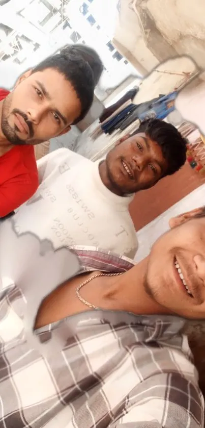 Casual group selfie outdoors with friends smiling.