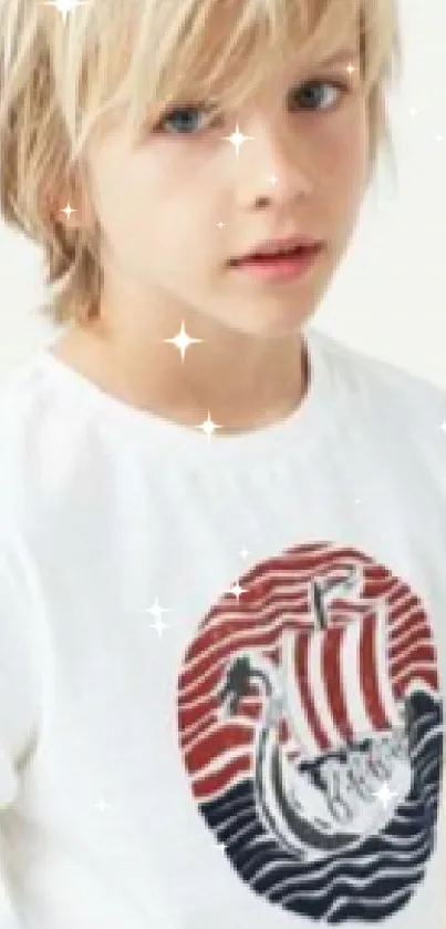 Young blonde boy in casual outfit with Nordic-themed shirt design.