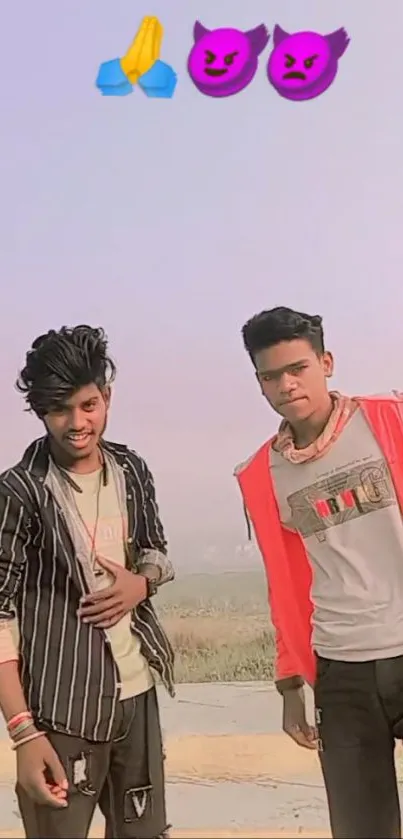 Two young men posing outdoors, casual attire.