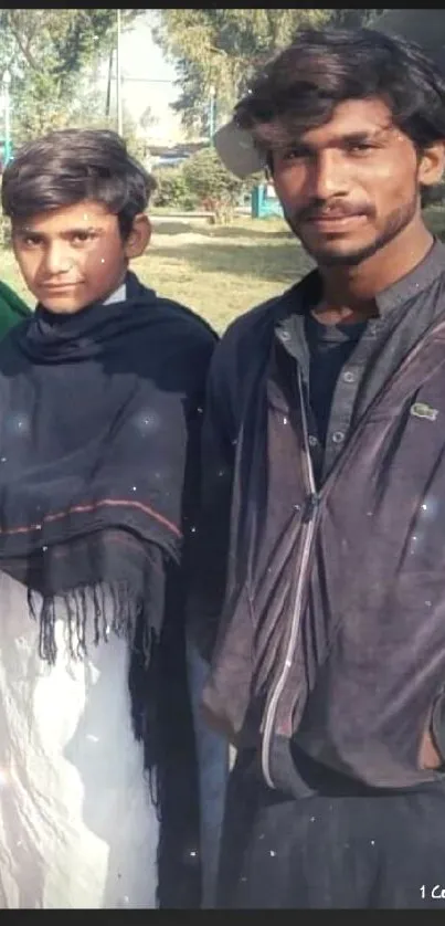 Outdoor portrait of two young people in casual attire.