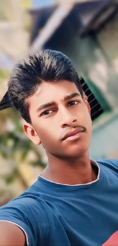 Portrait of a young person outdoors with a blurred background.