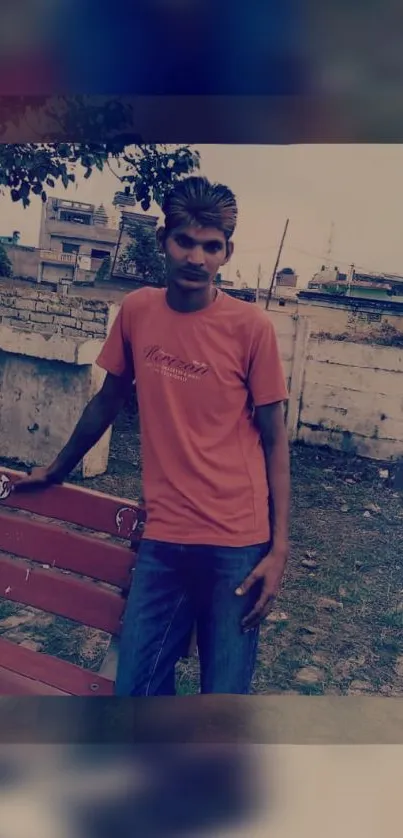 Casual portrait of a man outdoors with urban background.