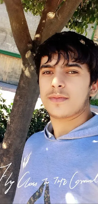 Casual outdoor selfie with natural background.
