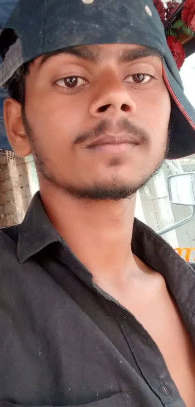 Young man in cap with urban backdrop, vibrant colors.