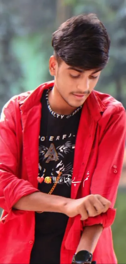 Young man in a red shirt, stylishly posing.