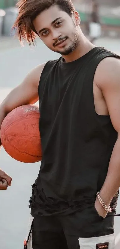 Stylish youth with basketball, in casual attire.