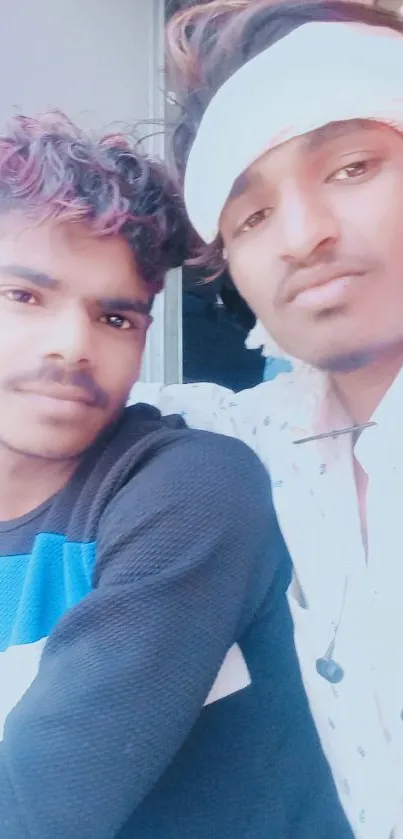 Two friends on a vibrant train journey, wearing colorful attire.