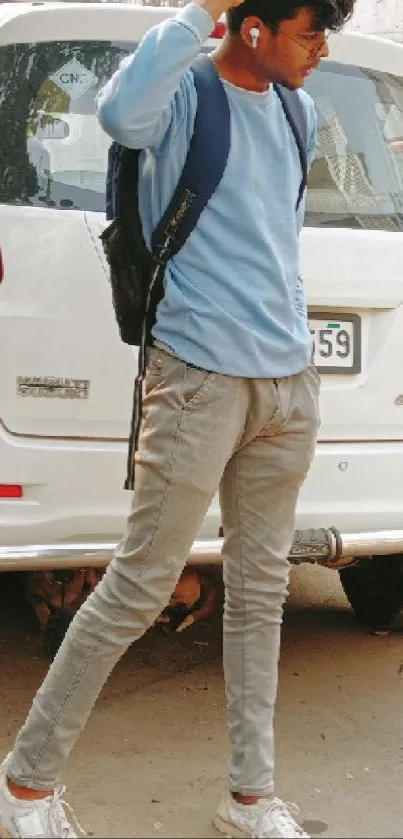 Young man with backpack in urban street fashion.