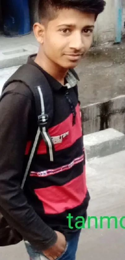 Young person in urban street setting with casual attire.