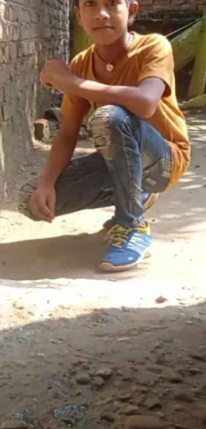 Young person in outdoor setting wearing brown and blue clothing.