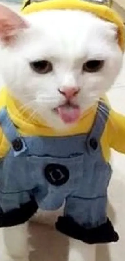 White cat in cute Minion outfit posing playfully.