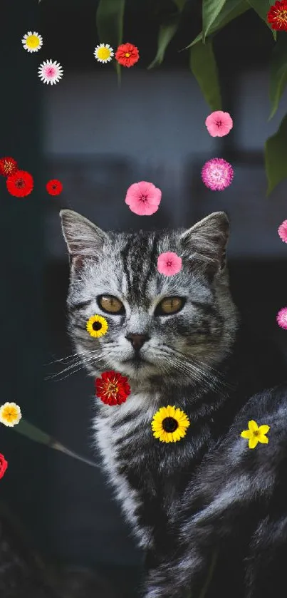 Grey tabby cat with colorful flowers in dark background.