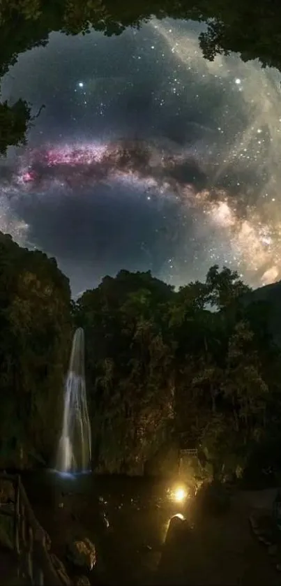 Starry sky viewed through a cave with a waterfall at night.