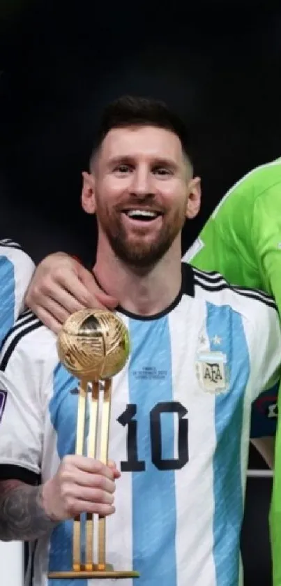 Three football players celebrating with trophies in vibrant jerseys.