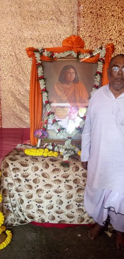 Ceremonial image with framed portrait and traditional decor.