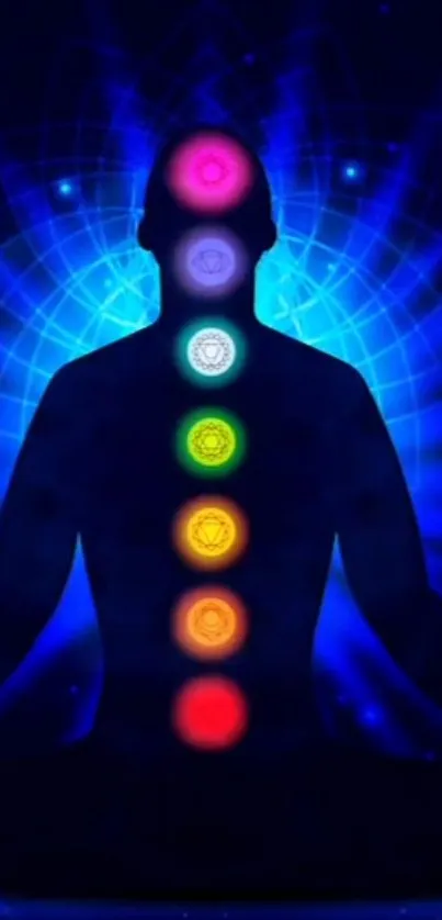 Meditative silhouette with chakras in vibrant blue and multi-color energy fields.