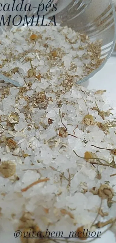 Close-up of chamomile and salt on a surface, evoking relaxation.