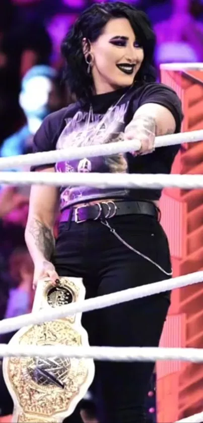 Wrestling champion holding a decorated title belt in the ring.