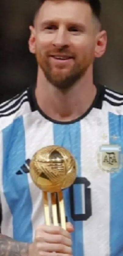 Athlete proudly holding a trophy on field.