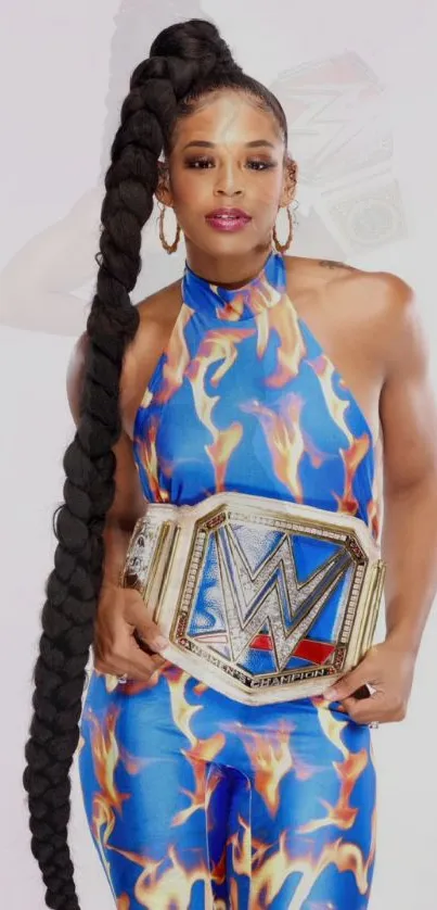 Champion with flame outfit and title belt.