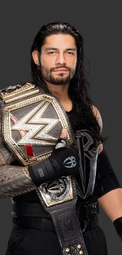 Wrestling champion holding a championship belt against a dark background.