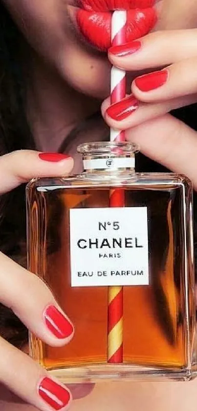 Chanel N°5 perfume with red lips and nails.