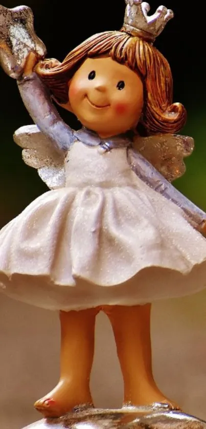 Charming angel figurine with star mobile wallpaper.