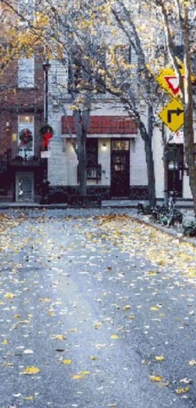 Serene autumn street with fallen leaves and quaint buildings.