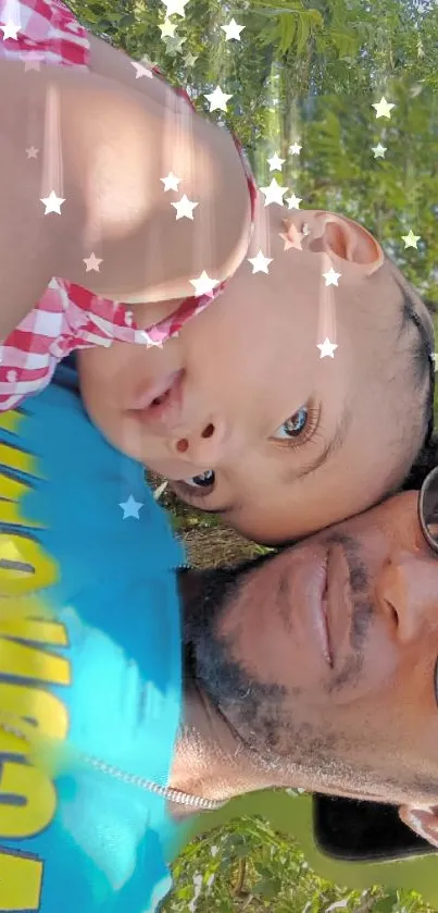 Baby cuddling with adult under starry sky.