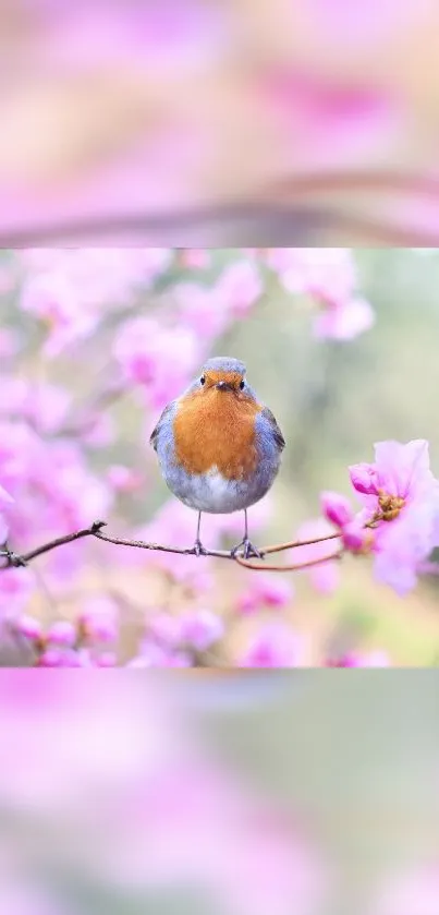 A small bird on a branch surrounded by pink flowers.