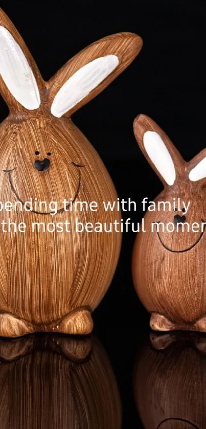 Wooden bunny figurines on black background, symbolizing family love.