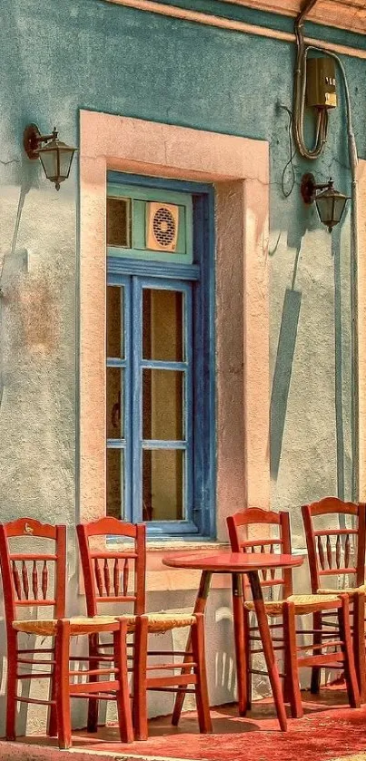 Quaint outdoor cafe with chairs and a blue window frame.