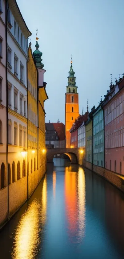 Charming cityscape with canal at dusk and colorful buildings reflecting in water.