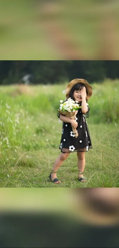 Young girl in dress and hat holding flowers in a green field.