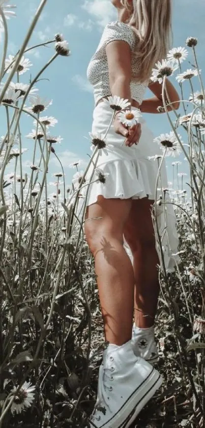 Woman in white dress in daisy field.