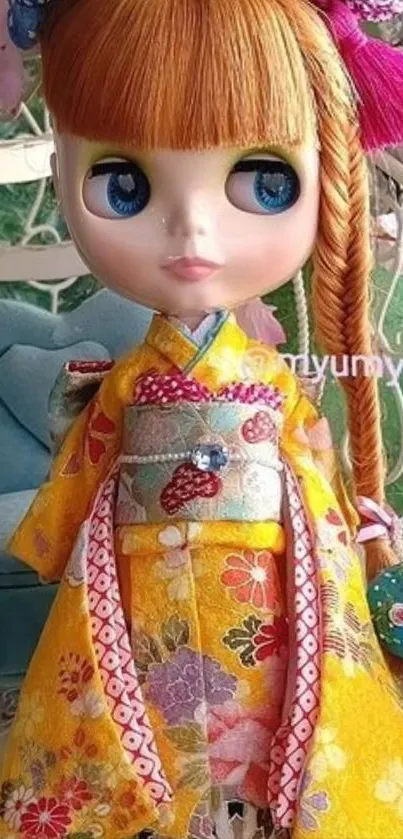 Doll in vibrant yellow kimono with colorful embroidery.