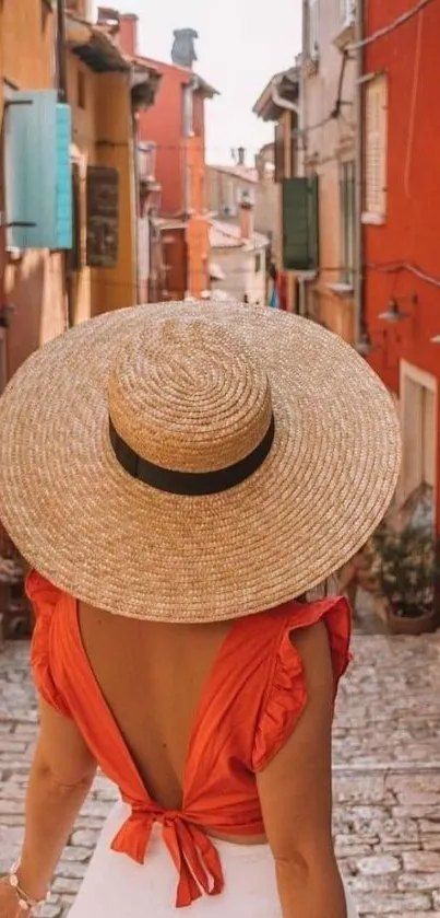 Woman in orange dress and hat in a charming European street.