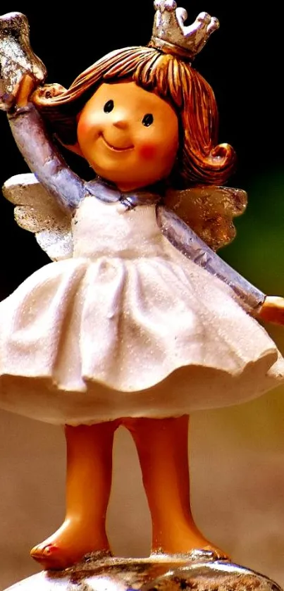 Charming fairy figurine with golden wings and crown.