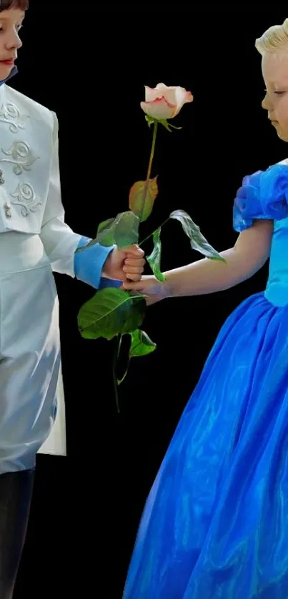 Children in prince and princess costumes share a rose on black background.