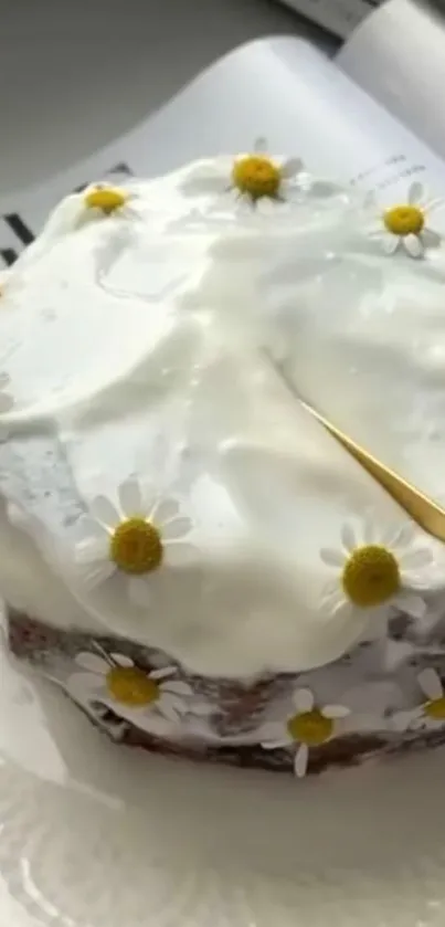 Charming cake with white icing and yellow flowers on a plate.