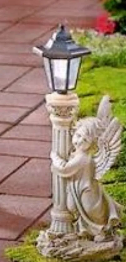 Garden scene with angel statue hugging a lantern on a green path.