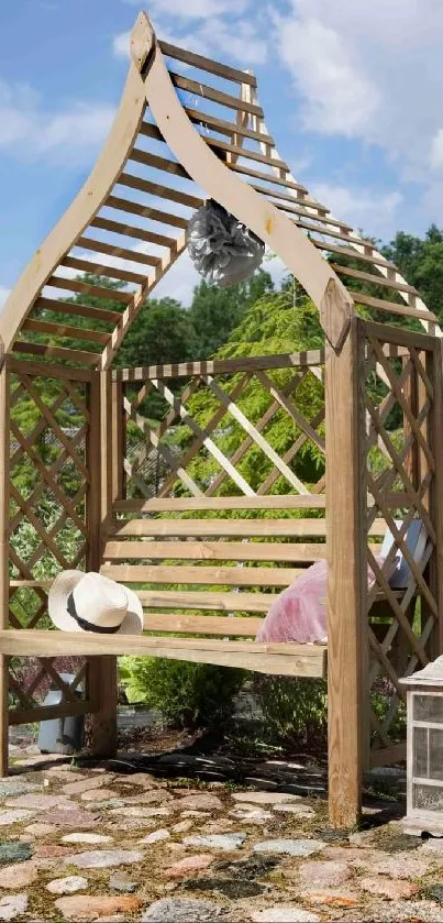 Rustic garden bench with wooden arch under blue sky.