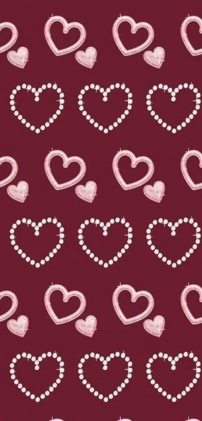 Charming phone wallpaper with pink and white heart patterns on a burgundy background.