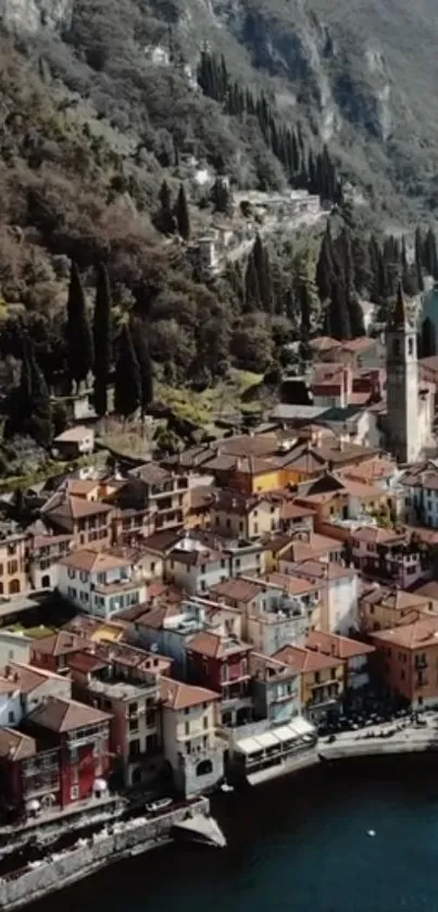 Aerial view of a charming Italian village with colorful houses and a mountain backdrop.