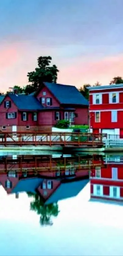 Vibrant lakeside village reflected on tranquil water under a colorful sky.