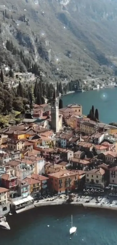 Aerial view of a quaint lakeside village with terracotta rooftops.