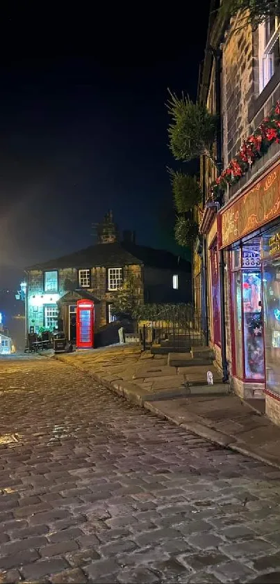 Charming cobblestone street with colorful night lighting.