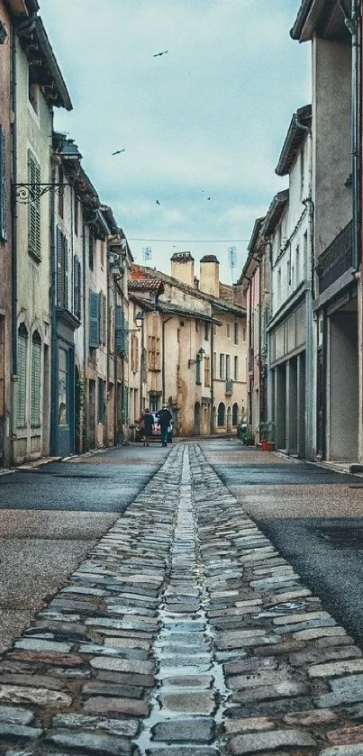 Charming old street with cobblestones and rustic buildings.