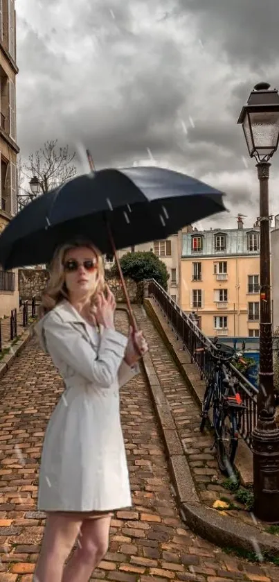 Woman with umbrella on a Paris cobblestone street.