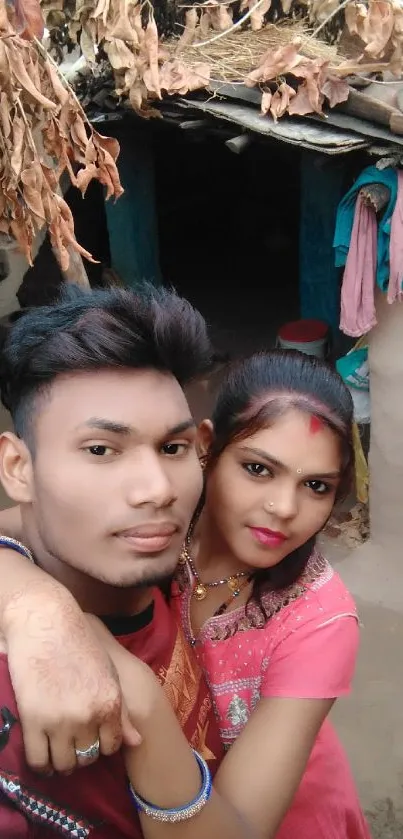 Couple posing for a selfie in a rural village setting.